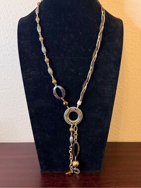 Chico's Multi-Tone Metals Features an Asymmetrical Drop Design with Amber